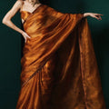burnt amber tissue silk saree.