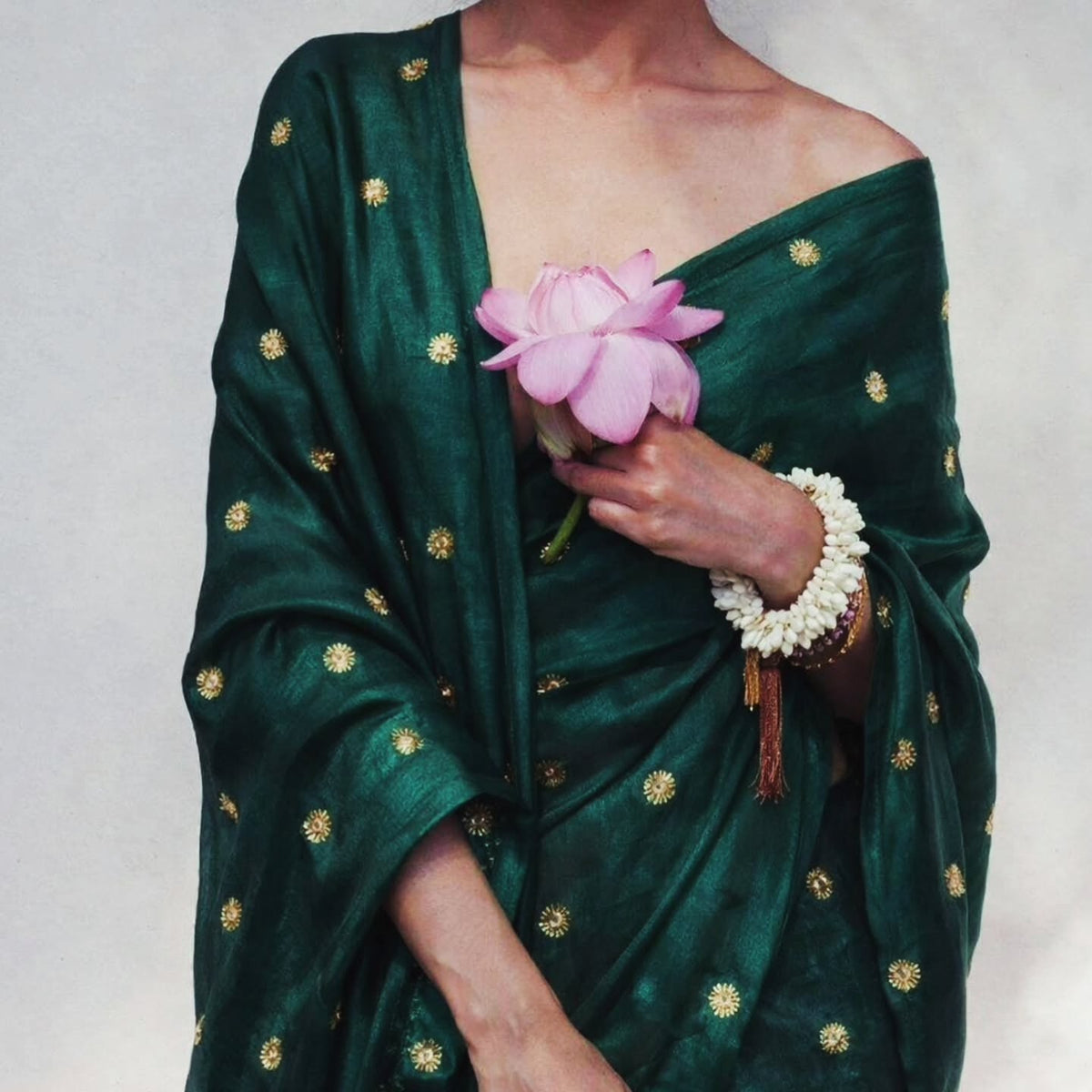 vintage green tissue silk saree with hand embroidery buti.